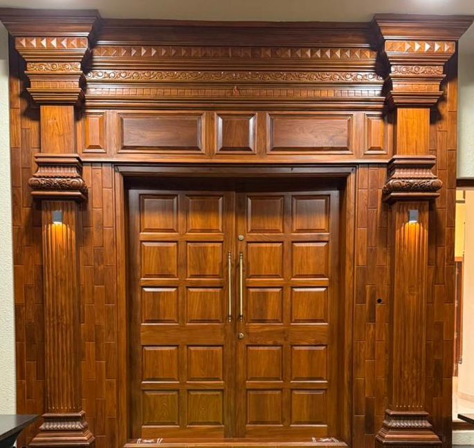 Intricate panel teak wood double door design